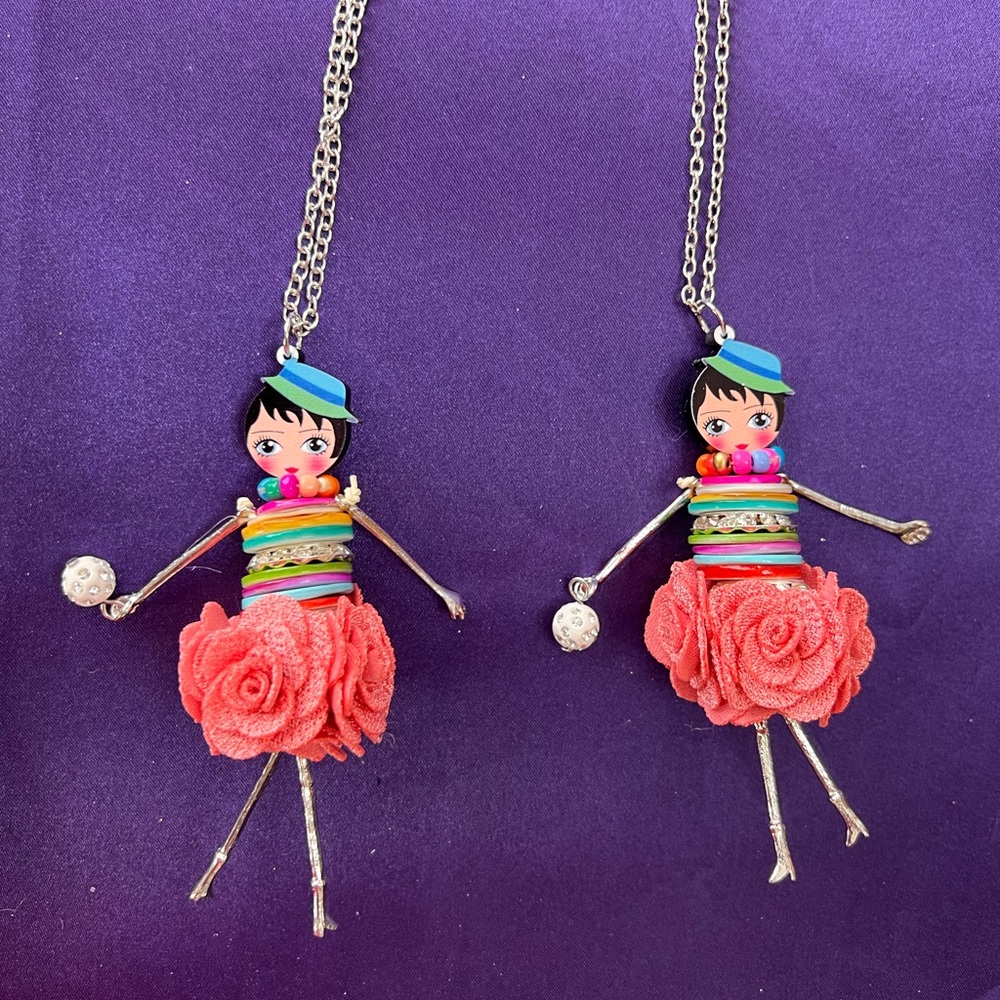 This darling necklace is 4 1/4” tall and 1 1/4” wide & comes on a 28” chain.